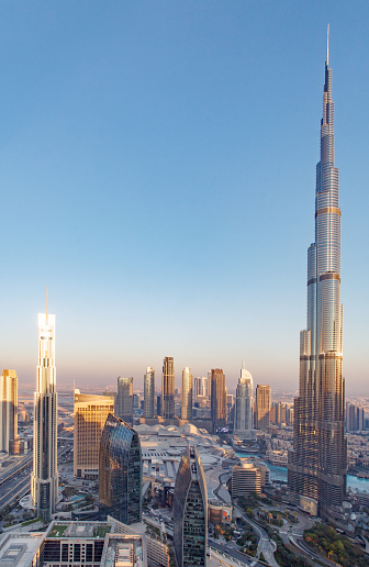 Dubai, UAE  april 06, 2023: area Downtown, Burj Khalifa, Boulevard Plaza Tower, Address Downtown, vertical frame, sunset time