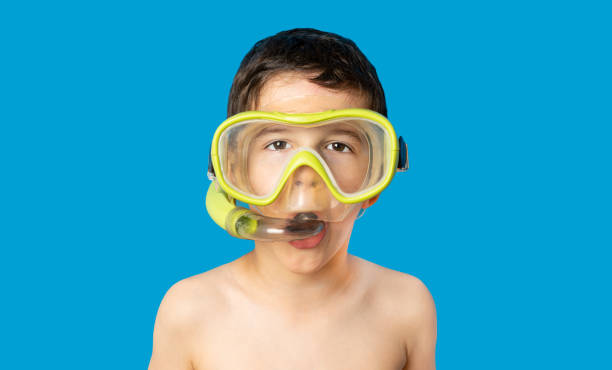istock little boy with scuba mask ready to diving 1501759194