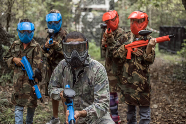 istock Young children playing paintball together during a skirmish 1501759227