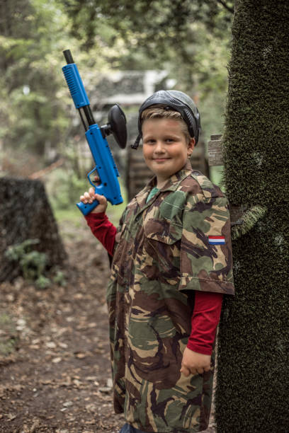 istock A young male paintball team player during the game 1501759233