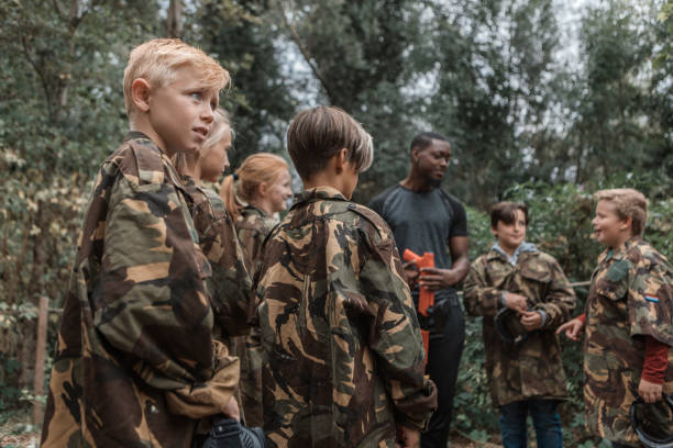 istock Paintball fun for group of children 1501762311