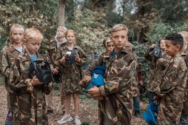 istock Paintball fun for group of children 1501762331