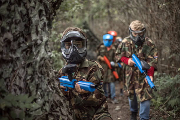 istock Paintball fun for group of children 1501762357