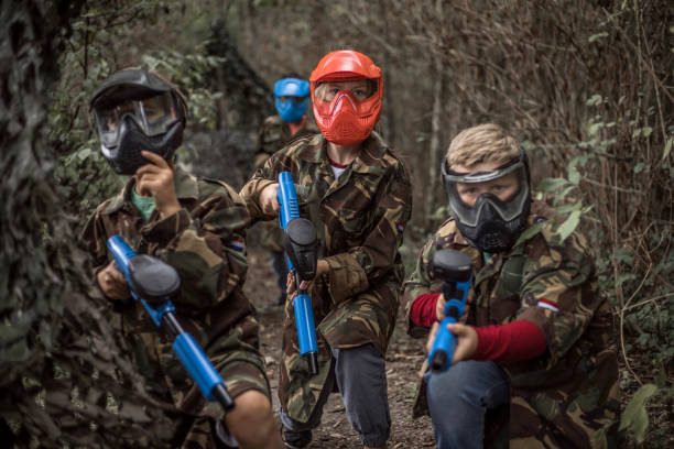istock Paintball fun for group of children 1501762425