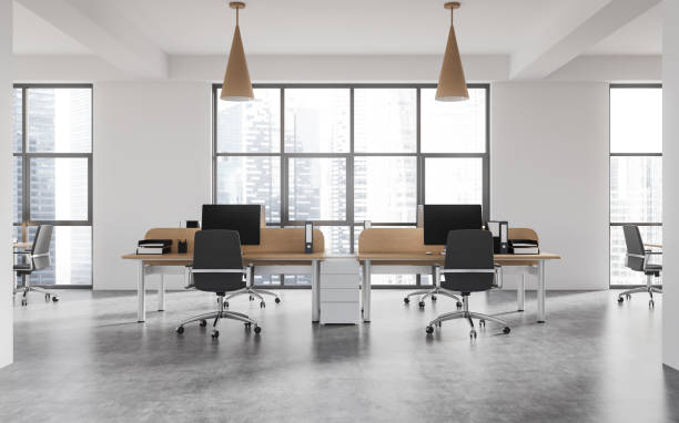 istock Modern business room interior with desk in row, pc computer and panoramic window 1501762627