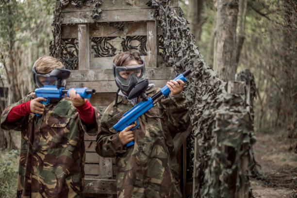 istock Paintball fun for group of children 1501762657