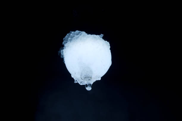 istock Frozen lamp glows in ice and snow at night 1501763097
