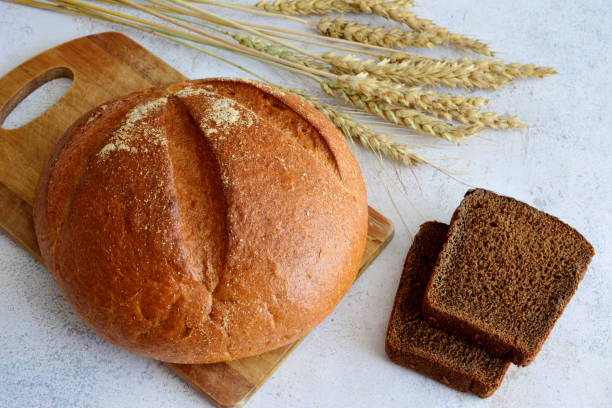 istock wheat and rye bread on cutting board isolated, close up 1501764008