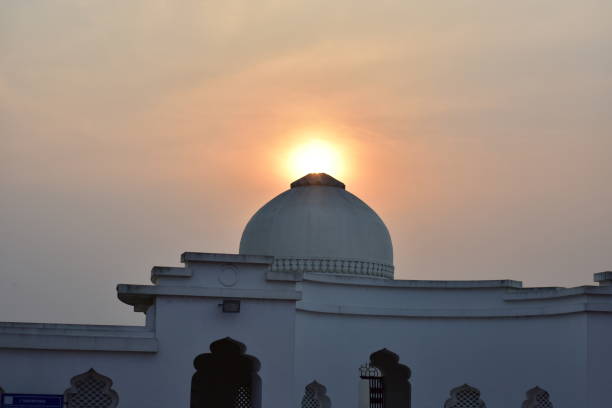 The silhouette of an Iranian mosque at dusk - the dome and crescent symbol make a generic background for Islamic issues