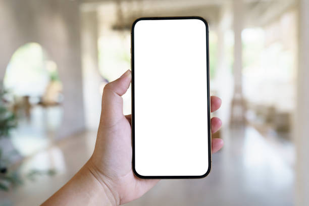 istock Women's hands holding cell telephone blank copy space screen. smartphone with blank white screen isolated. smart phone with technology concept. 1501765563