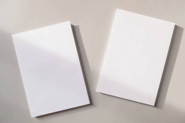 istock White blank greeting or invitation card mockup on gray background. Mock up presentation. 1501765616