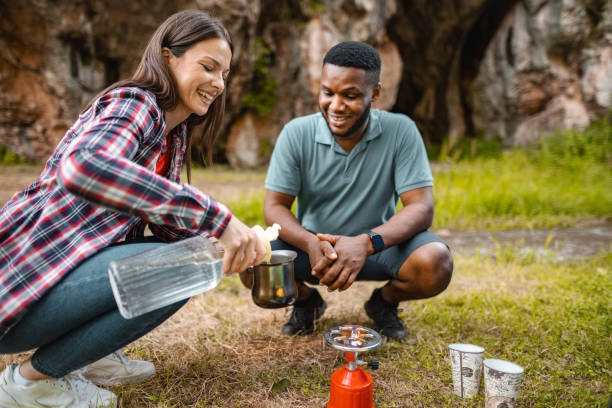 istock Young couple making coffee in the mountain 1501767284