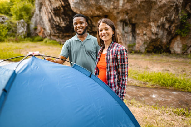 istock Happy couple posing behind the tent by the stream 1501767399