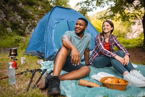 istock Young couple enjoying the picnic in nature 1501767708
