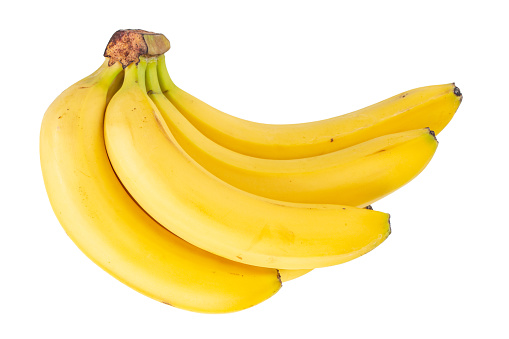 Fresh ripe bananas in a bowl on a black and gray background with copy space