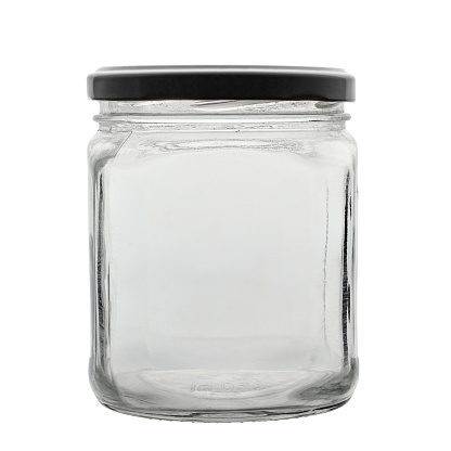 Transparent empty jar with a lid, for conservation. Isolated on a white background. File contains clipping path