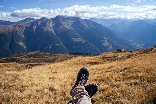 Hiking boots on the top of the mountain in the summer.