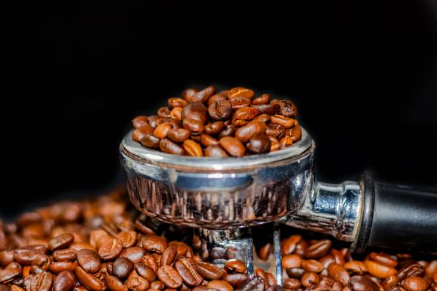 istock Coffee beans put on the basket with black background. 1501772246