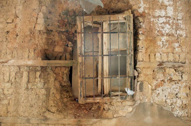 Old Brick Wall with Broken Window in Sarajevo City Center Post Balkan War. Ruined House in Bosnia Herzegovina