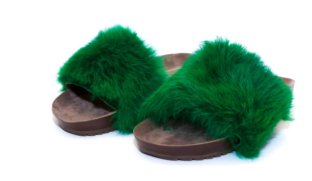 istock Slippers with green fur on white background 1501773976