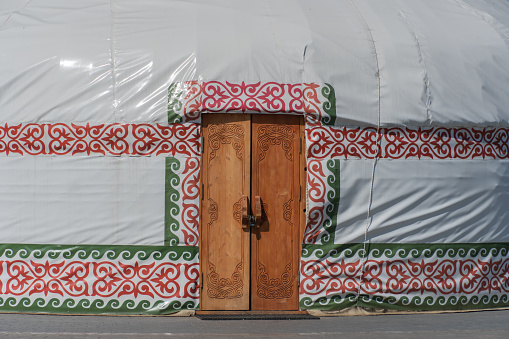 Round white yurt kazakhstan nomads. Traditional asian house with ornament and door. Dwelling mongolian, kyrgyzstan, uzbekistan of tribes. East national home. Exterior holiday camp. Lifestyle nomads.