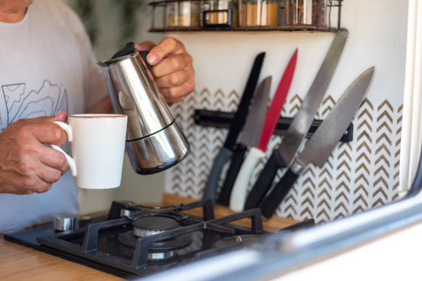 istock man serving himself coffee in his motorhome kitchen 1501775070