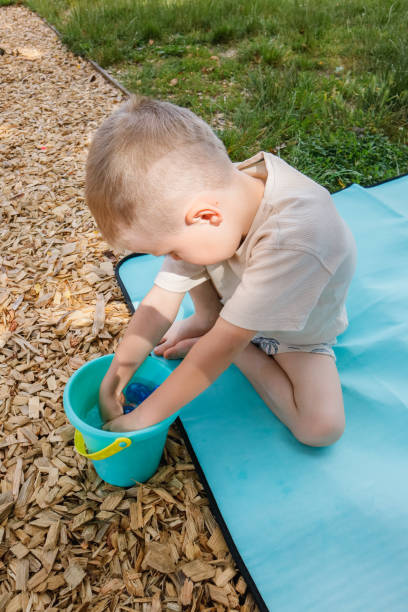 istock A child plays with a water gun on the playground 1501780184