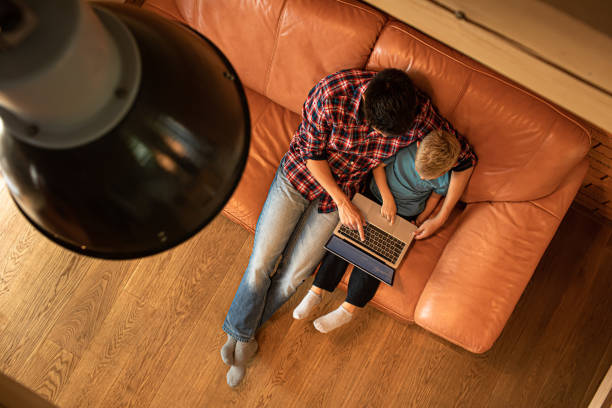 istock Father helping his son to do homework. Online learning. 1501785690