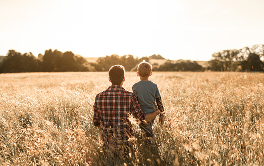 Father and son enjoying nature setting.