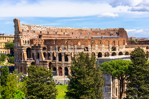 Rome, Italy - April 27, 2023:  The Colosseum, an amphitheatre in the center of Rome, the largest ancient theatre ever built.
