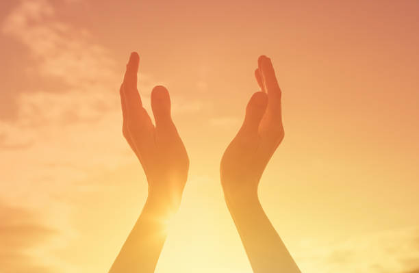 istock Hands up to the sun light sky. 1501786848