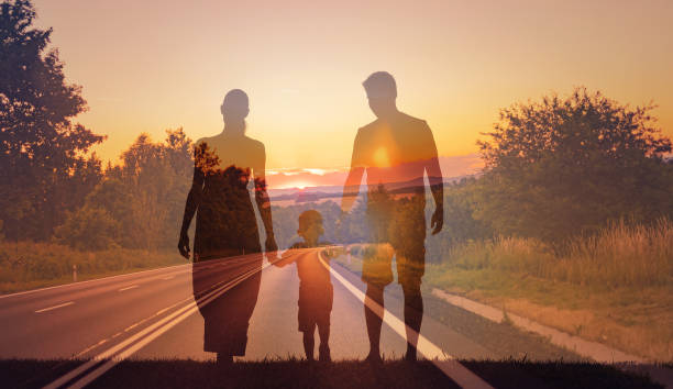 istock Family together walking down empty road. 1501786900