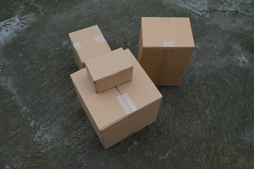 Photo of a pile of brown cardboard boxes