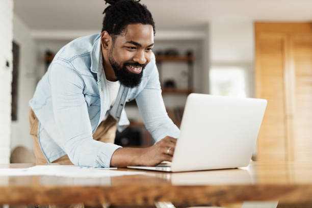 istock African American man working on computer at home 1501791050