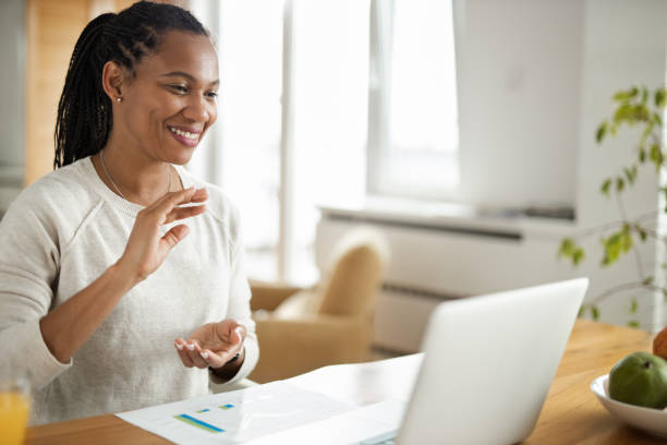 istock Young black woman having a video call at home 1501791156