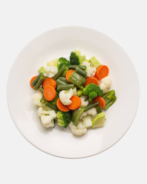 istock boiled, steamed vegetables on a white plate, top view 1501791334