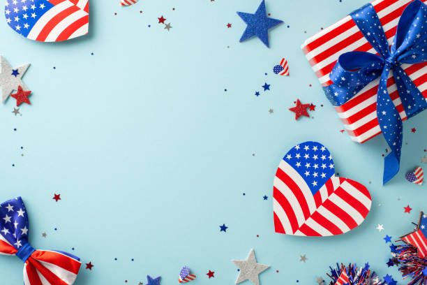 istock Presidents' Day celebration. Top view showcasing symbolic elements: hearts with USA flag pattern, stars, confetti, giftbox wrapped in thematic paper, set on light blue backdrop with frame for text 1501793287