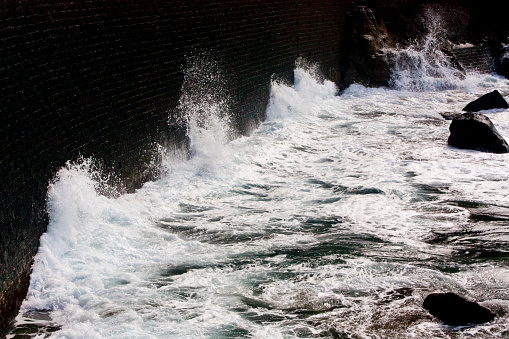 Porto Capelas fishing old port stone dock Ponta Delgada,  Sao Miguel island, Azores. . Breaking waves.