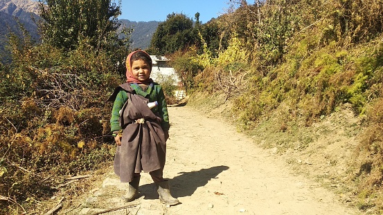 Chamoli, Uttarakhand, India. Picture of a cute himalayan village girl in her traditional dress.