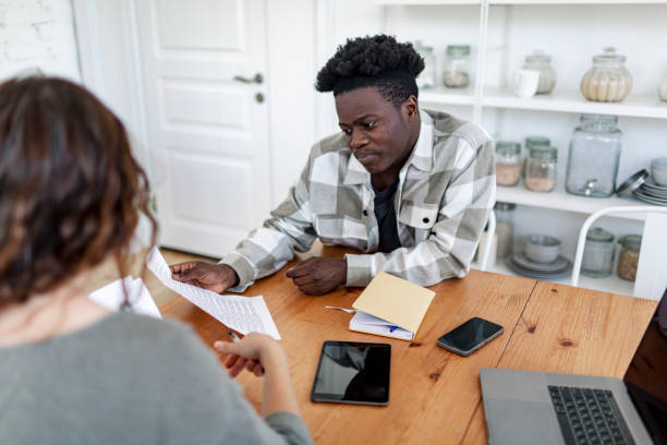 istock Financial consultant giving to sign new agreement to client 1501797607