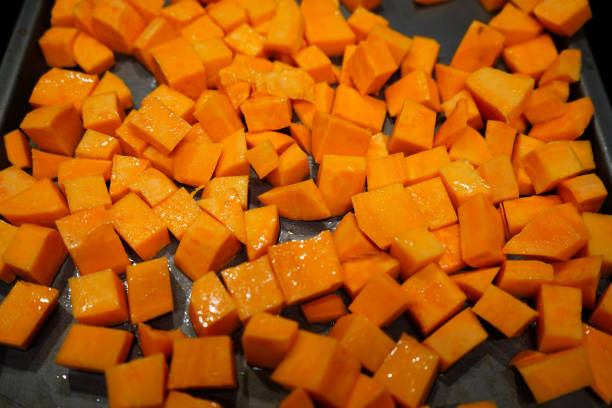 istock Cut up chunks of sweet potato on a baking tray 1501797840