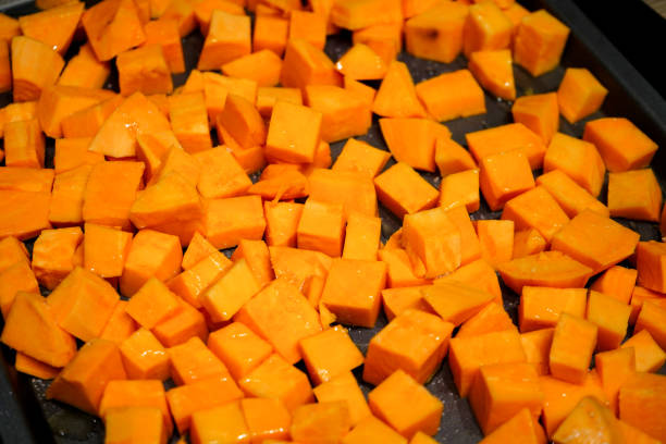 istock Cut up chunks of sweet potato on a baking tray 1501798033