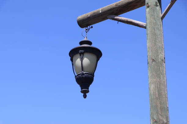 istock Old wooden lanterns hanging on a wooden pole. 1501801676