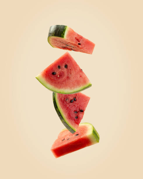 istock pieces of watermelon on a beige background, levitation 1501819471