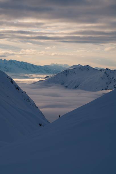 istock Vertical shot of mountains covered with white snow under the cloudy sky 1501903470