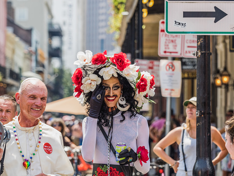New Orleans, Louisiana, USA, September 3, 2017: a man dressed as the pope walks next to another dressed in drag during Southern Decadence in New Orleans, Louisiana.