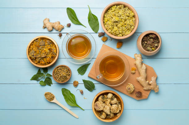 istock Herbal tea with ingredients on wooden background, top view 1501910827