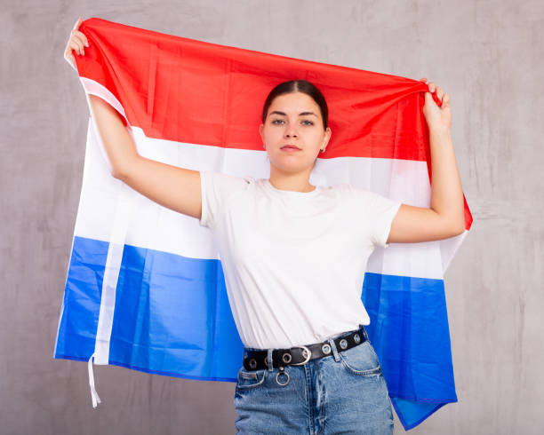 istock Focused woman holding Netherlands flag 1501956295