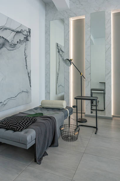 istock stylish bright modern bedroom interior with decorative niches with LED lighting and a huge panoramic window in gray and white colors and geometric shapes 1501974124