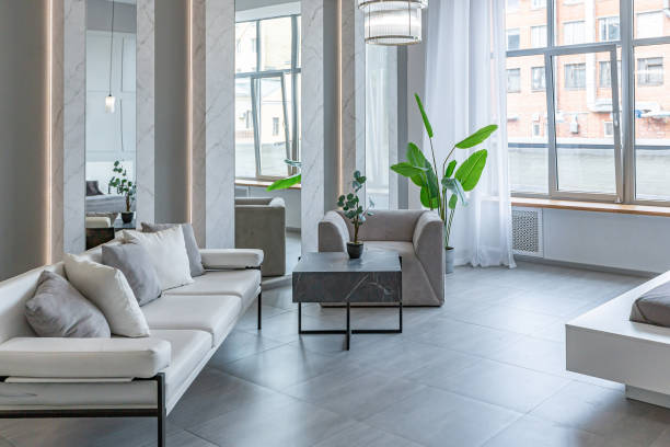 istock stylish bright modern bedroom interior with decorative niches with LED lighting and a huge panoramic window in gray and white colors and geometric shapes 1501974178
